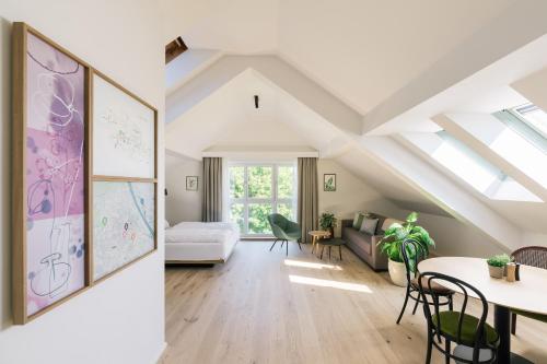 a living room and a dining room with skylights at Bio-Hotel Schani Wienblick in Vienna