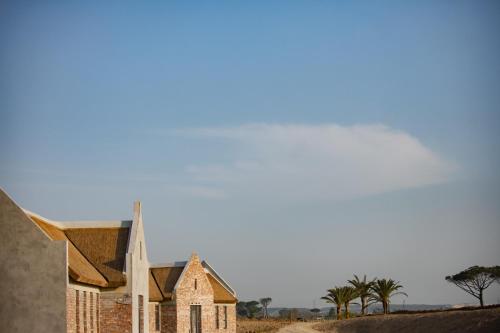 an old church in the middle of a field at Vergenoegd Löw Boutique Hotel & Spa in Cape Town
