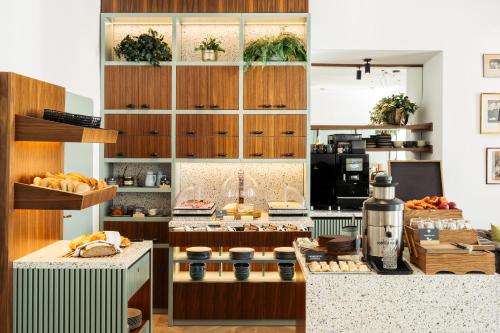 a kitchen with a bunch of food on a counter at Bio-Hotel Schani Wienblick in Vienna