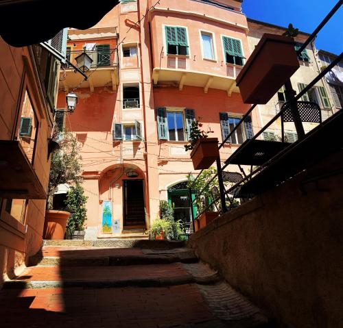 an empty alley with a building in the background at Magici ricordi-Bordighera in Bordighera
