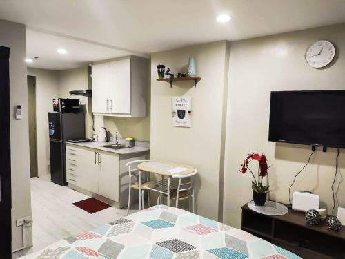 a room with a kitchen and a living room at Cityscape Grand Tower Condominium in Cebu City