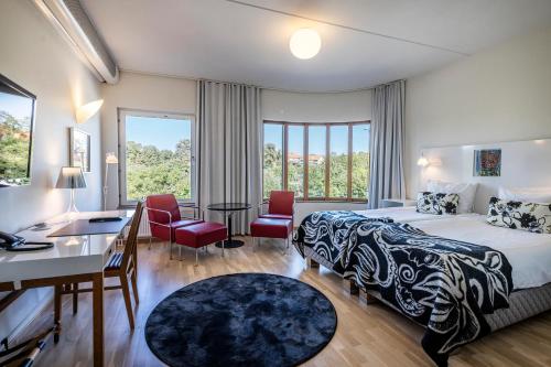 Postel nebo postele na pokoji v ubytování First Hotel Planetstaden