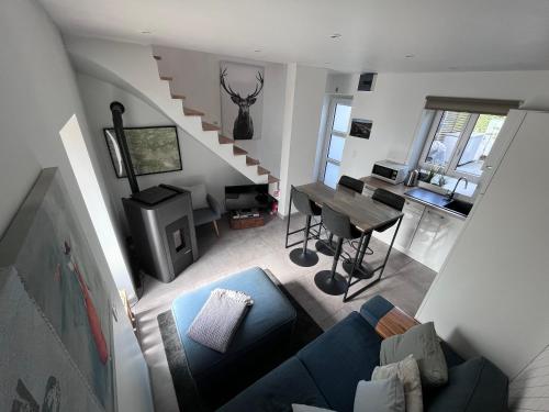 an overhead view of a living room with a blue couch at L’Aragne in Dinant