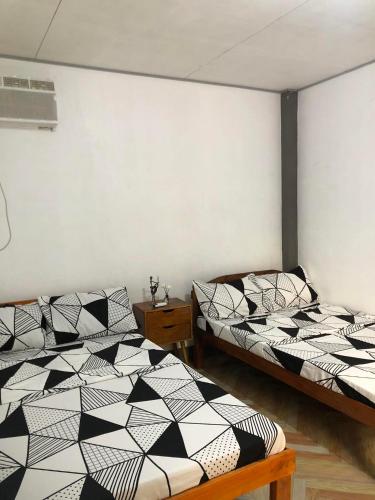 Кровать или кровати в номере TRADITIONAL PRIVATE GUESTHOUSE in PATAR BEACH