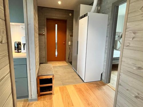 a hallway with a refrigerator in a room at Salmons väg Funäsdalen in Funäsdalen