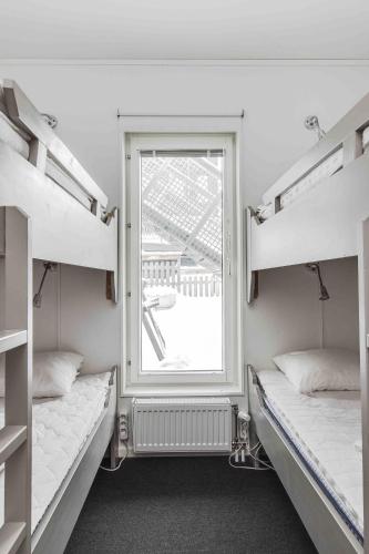 a room with two bunk beds and a window at Funäs Ski Lodge in Funäsdalen