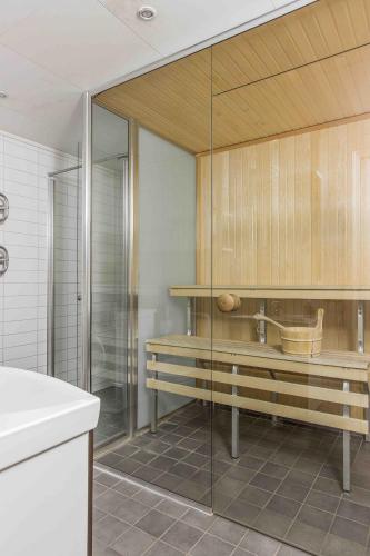 a bathroom with a shower and a sink at Funäs Ski Lodge in Funäsdalen
