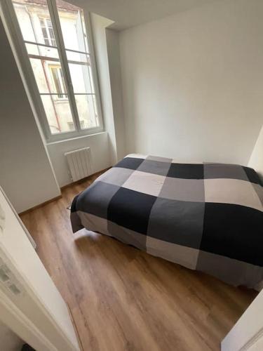 Krevet ili kreveti u jedinici u objektu Appartement au cœur de Tonnerre