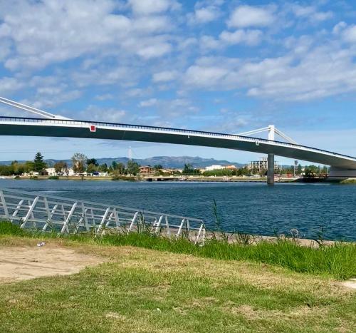 a bridge over a body of water at Ca La Marta in Sant Jaume d'Enveja
