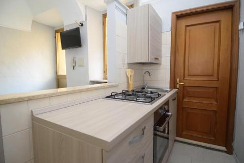 a kitchen with a stove and a counter top at il sogno in Biella