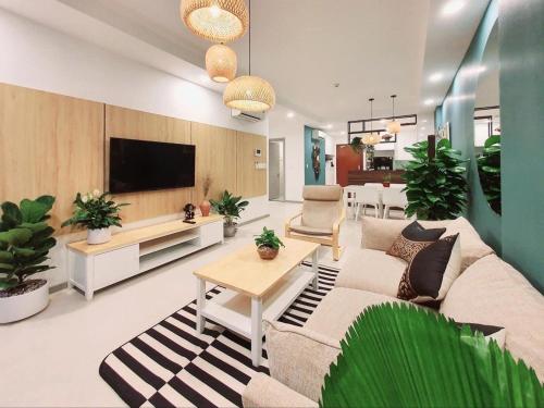 a living room with a couch and a tv at 30% promotion for Gold view apartment in the center of District 4, Ho Chi Minh, Vietnam in Ho Chi Minh City