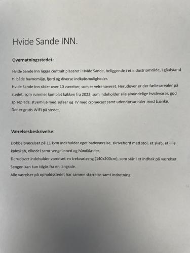 a typed document on top of a white paper at Hvide Sande Inn in Hvide Sande