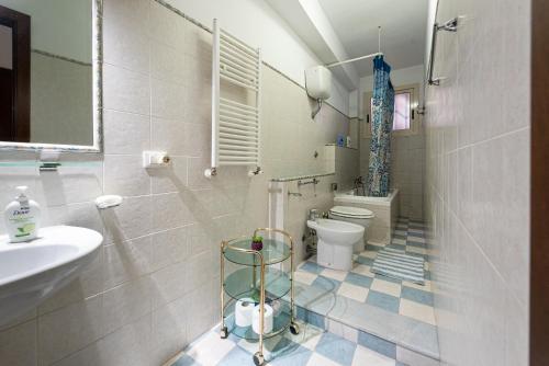 a bathroom with a toilet and a sink at A casa di Manu in Trabia