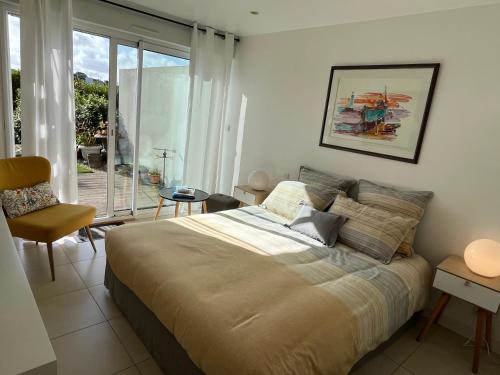 Ένα ή περισσότερα κρεβάτια σε δωμάτιο στο Chambre d'Hôtes de la Grande Greve