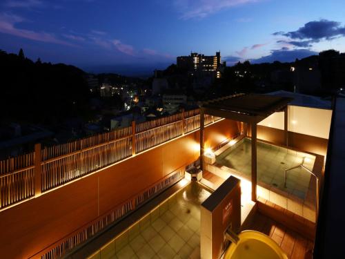 a balcony of a building with lights on it at Arima Royal Hotel in Kobe