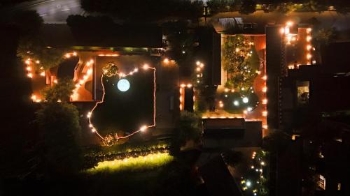 an aerial view of a house at night with lights at Brickyard Retreat at Mutianyu Great Wall Adjoin to Mutianyu Great Wall - Room with the View of Great Wall - Chinese massage experience - Vehicle Shuttle Service - International Catering - SPA& Nail Beauty Facilities in Huairou