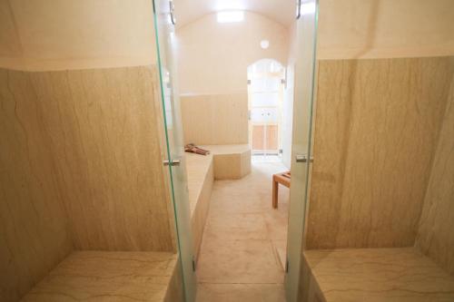 a bathroom with a shower stall and a tub at Villa Tizra - Guest house in AÃ¯n el Ksob