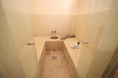 a small room with a hole in the floor at Villa Tizra - Guest house in AÃ¯n el Ksob