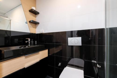 a bathroom with a sink and a toilet at Studio with City View Balcony 2 min to Metro in Istanbul