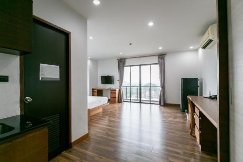 TV a/nebo společenská místnost v ubytování Farthai Residence