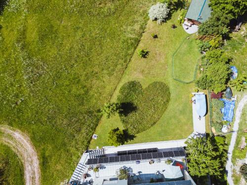 an overhead view of a yard with a building and a park at Pension Klug Adults only - DorfResort Mitterbach in Mitterbach