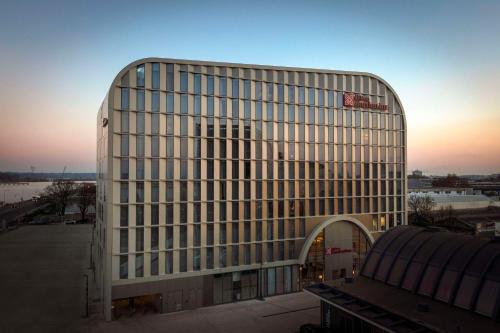 a large white building with a lot of windows at Hilton Garden Inn Bordeaux Centre in Bordeaux
