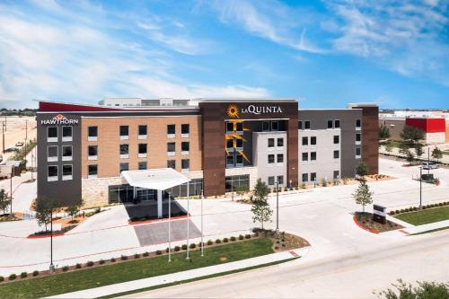 a rendering of the front of a hotel at Hawthorn Extended Stay by Wyndham Pflugerville in Pflugerville