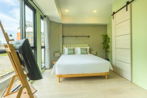 Chamemon Bed Phuket Townにあるベッド