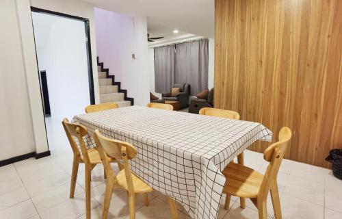 a dining room with a table and chairs at 3 mins to Garden City & Kubota Jln Chong Thien Vun in Tawau