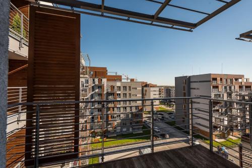 a balcony with a view of buildings at Apartamenty Tespis - Francuska Atal Park II in Katowice