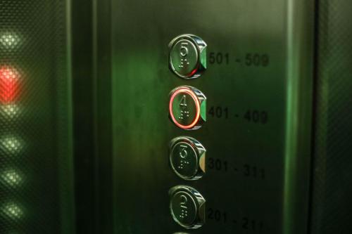 a close up of a control knob on a microwave at Hotel Berlino in Milan
