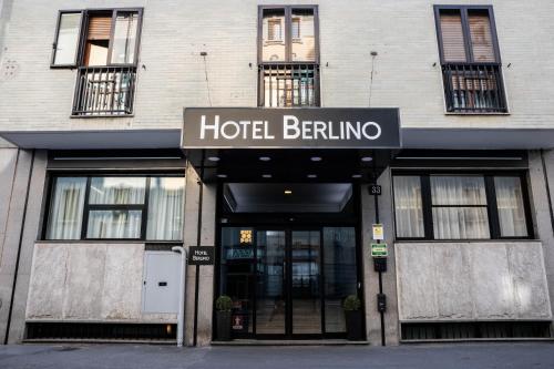 a hotel berlinino building with a sign on it at Hotel Berlino in Milan