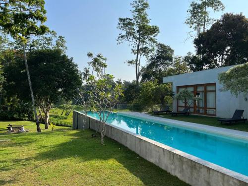 a house with a swimming pool in a yard at UYANA Boutique Hotel and Retreat ADULTS ONLY in Ahangama