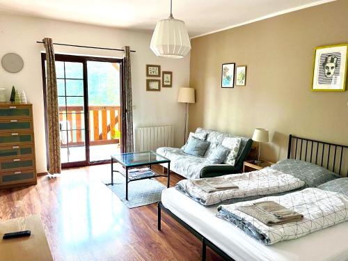 a living room with a couch and a table at Apartment Barbora 2 in Ružomberok