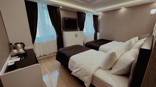 Телевизор и/или развлекательный центр в YILDIZ OTEL