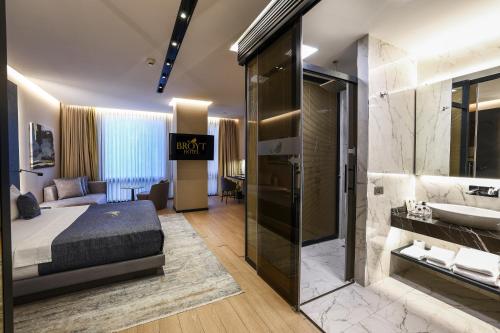 a hotel room with a bed and a bathroom at Broyt Hotel in Istanbul
