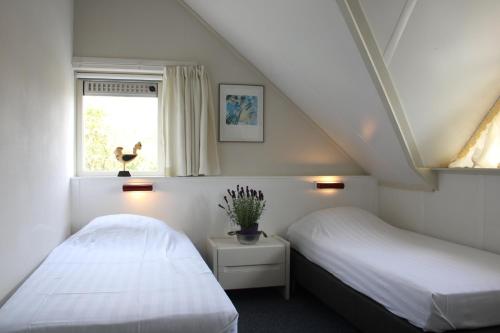Voodi või voodid majutusasutuse Watervilla de Rietzanger by Droomvilla toas