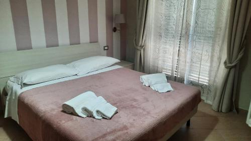 Una cama o camas en una habitación de Le terme a due passi
