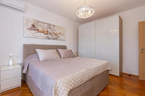 Apartman Dragomirにあるベッド