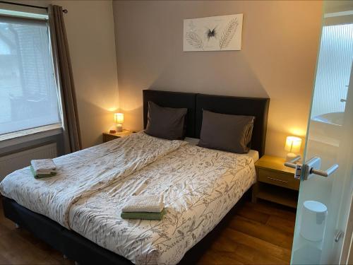 a bedroom with a bed with two pillows on it at Gretel von Birne in Winterberg