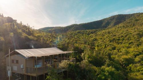 an aerial view of a house in the middle of a mountain at AfriCamps Addo in Swanepoelskraal