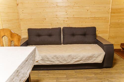 a couch sitting in the middle of a room at Готельно-ресторанний комплекс БОЖЕДАР in Vinnytsya