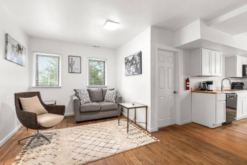 a living room with a couch and a kitchen at Opulent 2 Bedroom Getaway in Detroit