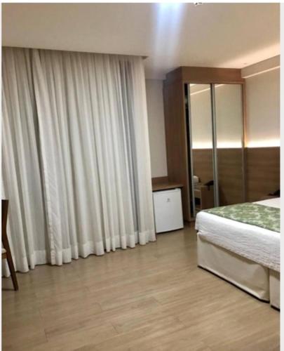 Un pat sau paturi într-o cameră la Hotel Vista Azul