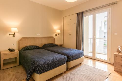 Cama o camas de una habitación en Delice Hotel - Family Apartments