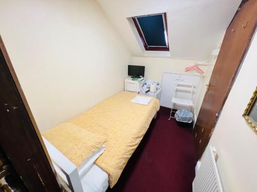 Postel nebo postele na pokoji v ubytování Aron Guest House