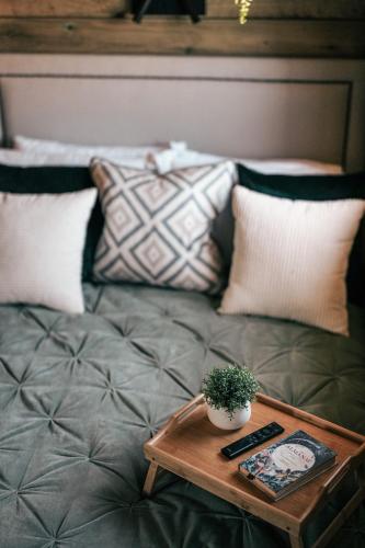 a coffee table sitting on a couch with pillows at The Potting Barn in Saint Ervan