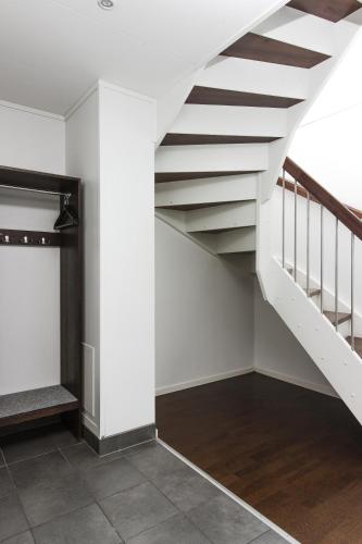 an empty room with a staircase in a house at Funäs Ski Lodge in Funäsdalen