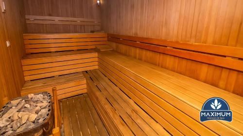 an empty sauna with wooden floors and a sign that says maxium at Maximum hamam Spa in Kusadası