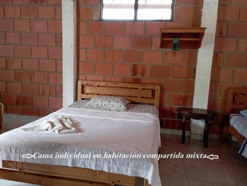 Una cama o camas en una habitación de Hostal Ariantiy